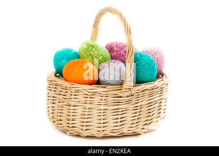 Easter eggs in a basket isolated over white Stock Photo