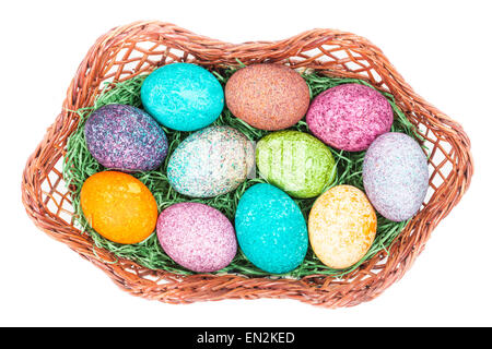 Easter eggs in a basket isolated over white Stock Photo