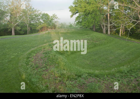 Serpent Mound with early morning mists and clouds Stock Photo