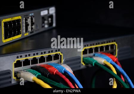 Network Switches with Multicolor Cables Stock Photo