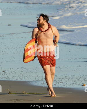 Actor Seth Rogen is lock and loaded on the beach and ready to surf for the new movie 'Zeroville' filming in Malibu Ca. The comedian was seen holding a surf board and 2 guns in their holsters with swimming trunks while filming a sunset scene on the beach. The new movie is also produced and directed by his good pal James Franco.  Featuring: Seth Rogen Where: Malibu, California, United States When: 22 Oct 2014