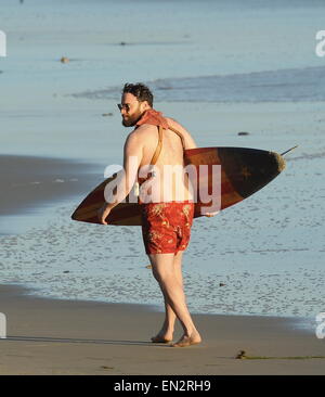 Actor Seth Rogen is lock and loaded on the beach and ready to surf for the new movie 'Zeroville' filming in Malibu Ca. The comedian was seen holding a surf board and 2 guns in their holsters with swimming trunks while filming a sunset scene on the beach. The new movie is also produced and directed by his good pal James Franco.  Featuring: Seth Rogen Where: Malibu, California, United States When: 22 Oct 2014