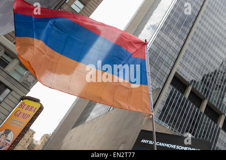 New York, NY - April 26, 2015: Armenian flag at rally in Manhattan Times Square to mark centennial of the deaths of 1.5 million Armenians under the Ottoman Empire in 1915 Stock Photo