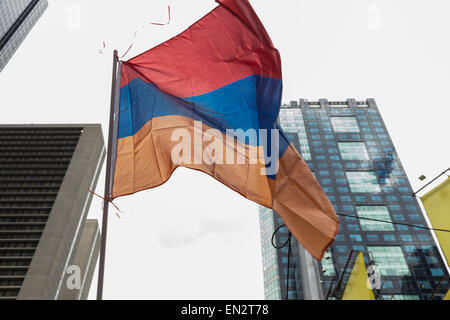New York, NY - April 26, 2015: Armenian flag at rally in Manhattan Times Square to mark centennial of the deaths of 1.5 million Armenians under the Ottoman Empire in 1915 Stock Photo