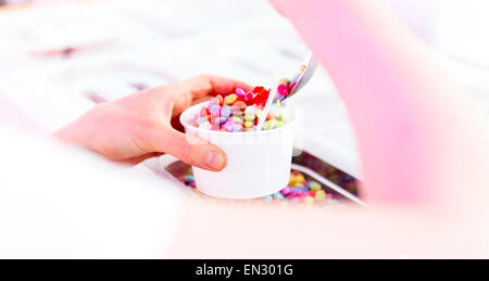 Blank paper cup with vanilla soft ice cream and smarties Stock Photo