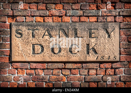 A stone sign on the wall of the historic Stanley Dock tobacco warehouse, Liverpool. Stock Photo