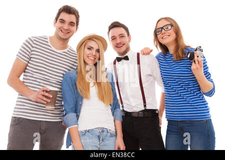Four stylish young people on white background Stock Photo