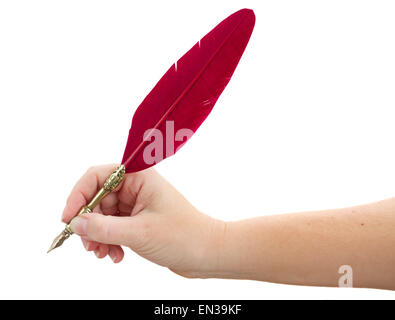 hand holding feather pen Stock Photo