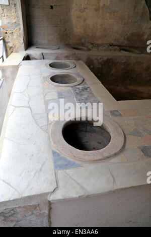 Marble covered counter Thermopolium of Vetutius Placidus, Pompeii, Italy. Stock Photo