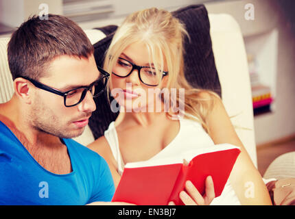 couple at home with book Stock Photo