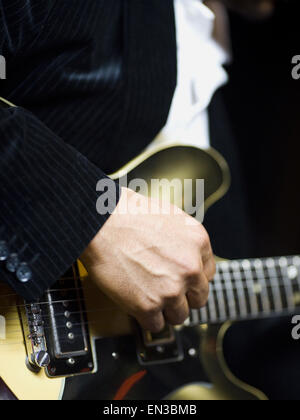 man playing a guitar Stock Photo