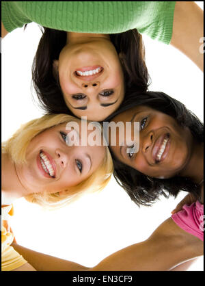 Three women hugging and smiling Stock Photo - Alamy