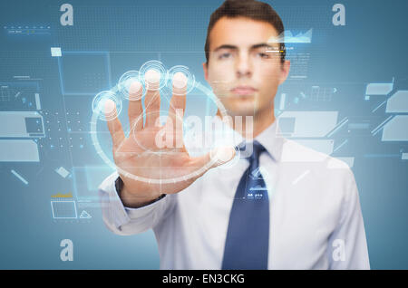 attractive buisnessman working with virtual sceen Stock Photo