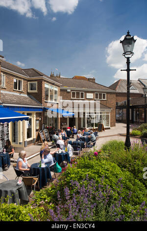 UK, England, Somerset, Taunton, Riverside Place, al fresco diners at riverside café in sunshine Stock Photo