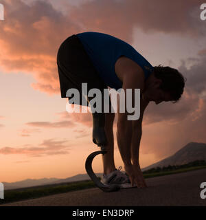 jogger with a right below knee prosthetic running leg Stock Photo