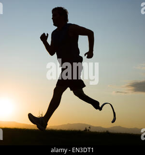 jogger with a right below knee prosthetic running leg Stock Photo