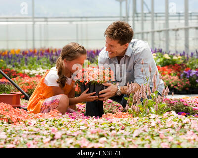 USA,Utah,Salem,Father with daughter (8-9) in greenhouse Stock Photo