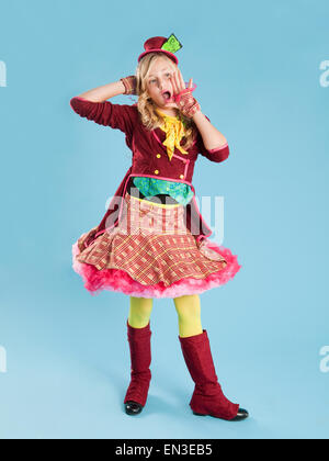 Portrait of girl (10-11) in Mad Hatter costume for Halloween Stock Photo