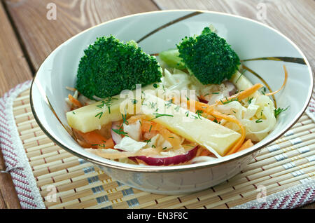 Maple slaw with broccoli and apple- variation of coleslaw of Canada.consisting of maple syrup, cabbage, onion, fish, and seasoni Stock Photo