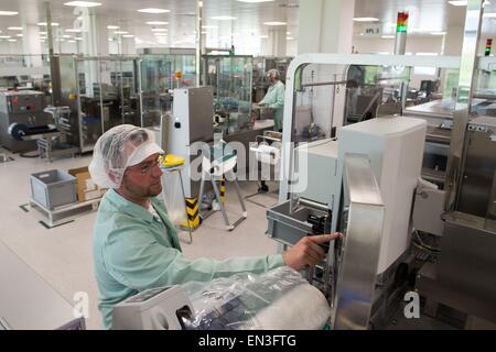 Jena, Germany. 27th Apr, 2015. Machine operator Oliver Schuchardt works in a factory of the EVER Pharma Jena GmbH in Jena, Germany, 27 April 2015. The pharmaceutical company opened a new plant and a new high rack warehouse in an industrial area near Jena the same day. The company invested 20 million Euros. Photo: SEBASTIAN KAHNERT/dpa/Alamy Live News Stock Photo