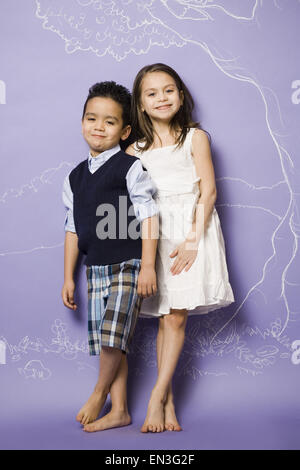 Young girl and boy holding hands smiling Stock Photo