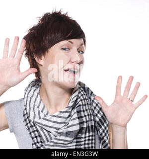 Young woman trapped against glass Stock Photo