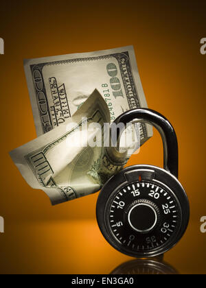 Combination lock with US hundred dollar bill Stock Photo