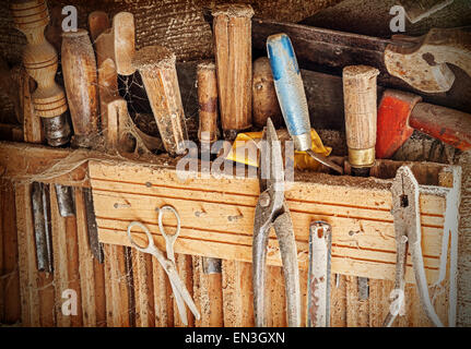 Retro filtered background made of old rusty woodworking tools. Stock Photo
