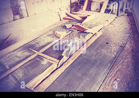 Vintage stylized circular saw in old carpenter's shop. Stock Photo
