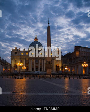 Italy, Rome, Vatican City, St. Peter's Basilica illuminated at dusk Stock Photo