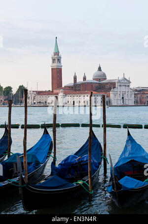 Italy, Venice, San Giorgio Maggiore church seen across lagoon, gondolas in foreground Stock Photo