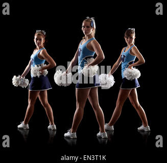Studio shot of three cheerleaders (16-17) Stock Photo