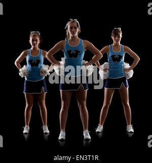 Studio shot of three cheerleaders (16-17) Stock Photo