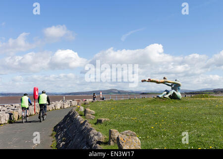 Cyclists Passing The Venus and Cupid Sculpture by Shane Johnstone, Scalestones Point Morecambe, Lancashire, UK Stock Photo