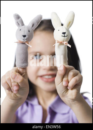 Girl with finger puppets Stock Photo