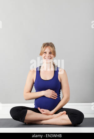 Portrait of young of pregnant woman, studio shot Stock Photo