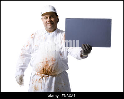 Butcher standing with blank sign Stock Photo
