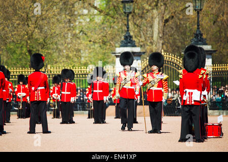 LONDON - APRIL 13: Queen's Guards at the Buckingham palace on April 13, 2015 in London, UK. Stock Photo