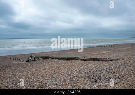 Eastbourne, UK. 25th April, 2015. UK Weather: Low clouds start to clear over a pebbled beach with protective groynes, resulting in a pleasant spring afternoon in Eastbourne on England's south coast . © Stephen Chung / Alamy Live News Stock Photo