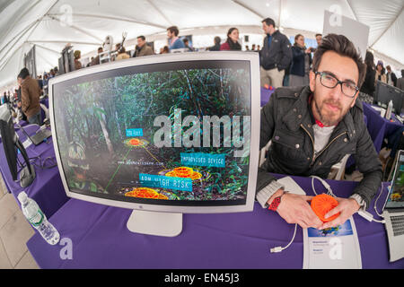 Carlos Bautista explains his method of detecting landlines to better protect soldiers and civilians using augmented reality built on edge-based tracking at the NYU-Polytechnic School of Engineering's Research Expo in Brooklyn's "Tech Triangle" in New York on Friday, April 24, 2015. Over forty research projects and their creators will exhibit and explain their research including cutting-edge robotics, engineering and biotechnology.  (© Richard B. Levine) Stock Photo