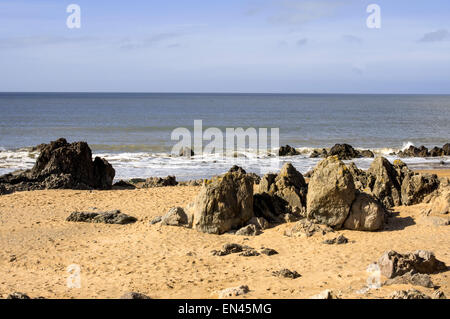 Waves breaking on rocks, Porth Nobla, Rhosneigr, Anglesey Stock Photo