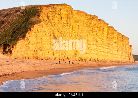 West Bay,Bridport,Jurassic Coast,Dorset,England,U.K. Popular Broadchurch tv series filmed here.Sundown at imposing East Cliff Stock Photo