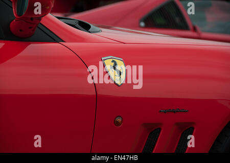 Red ferrari luxury cars badge on right hand side front fender Stock Photo