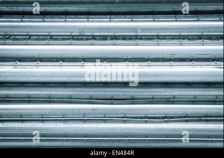 Metal poles stacked as an abstract background image Stock Photo