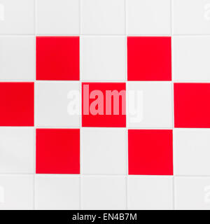 Red and white tiles on a wall Stock Photo