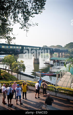 Tourist visiting the bridge over river Kwai, Kanchanaburi, Thailand. Stock Photo