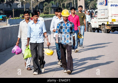 Mumbai India,Andheri East,man men male,construction workers,employee worker workers working staff,hard hats,hat,leaving work,India150226007 Stock Photo