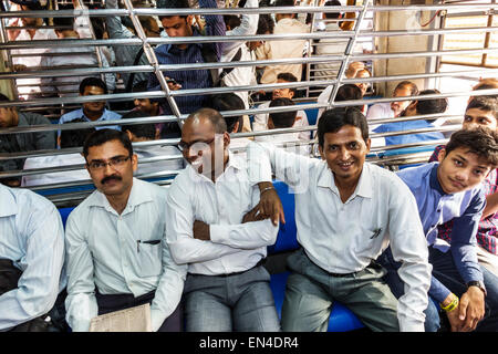 Mumbai India,Asian Andheri Railway Station,Western Line,train,commuters,riders,passenger passengers rider riders,man men male,2nd class cabin,sitting, Stock Photo