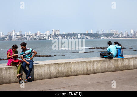 Mumbai India,Churchgate,Marine Drive,Back Bay,Arabian Sea,man men male,woman female women,couple,romantic,Malabar Hill skyline,buildings,India15022606 Stock Photo