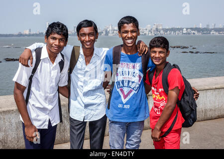 Mumbai India,Churchgate,Marine Drive,Back Bay,Arabian Sea,teen teens teenager teenagers male boy boys kids children student students friends,smiling,I Stock Photo